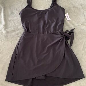 Old Navy women’s black one piece swimsuit with attached wrap around skirt. NWT